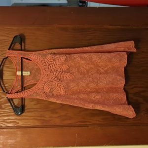 Pink sheer lace tank top with floral designs